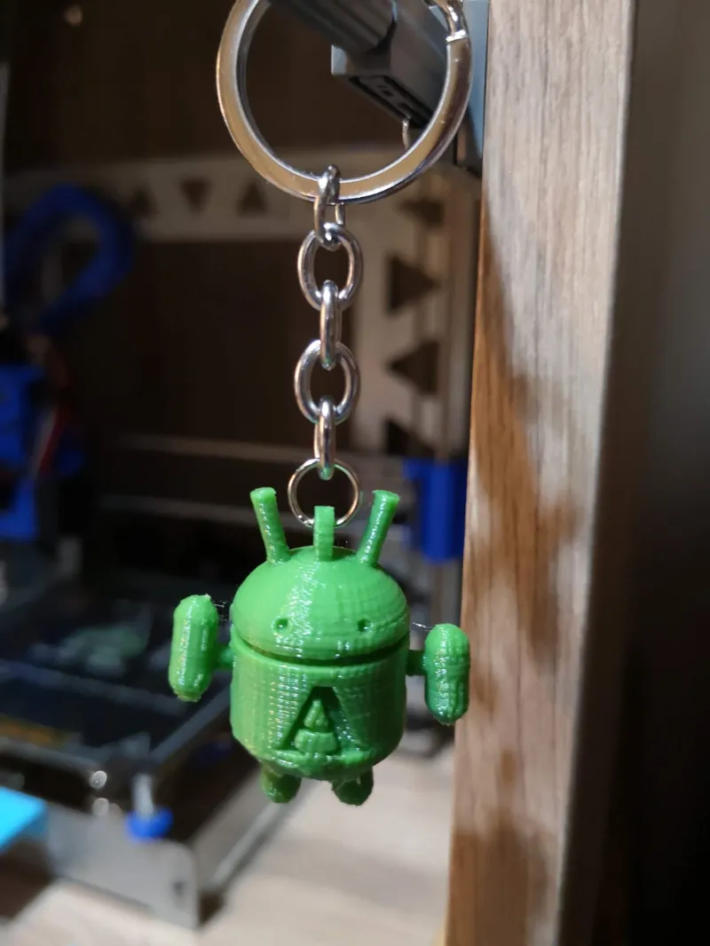 Llavero Android con brazos articulados