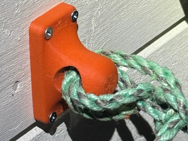 Wall-Mounted Rope Eyelet for Securing Trash Bins