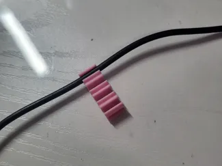 Wall mounted cable holder