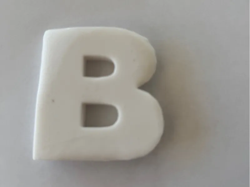 Cookie cutter in the form of a B read description 