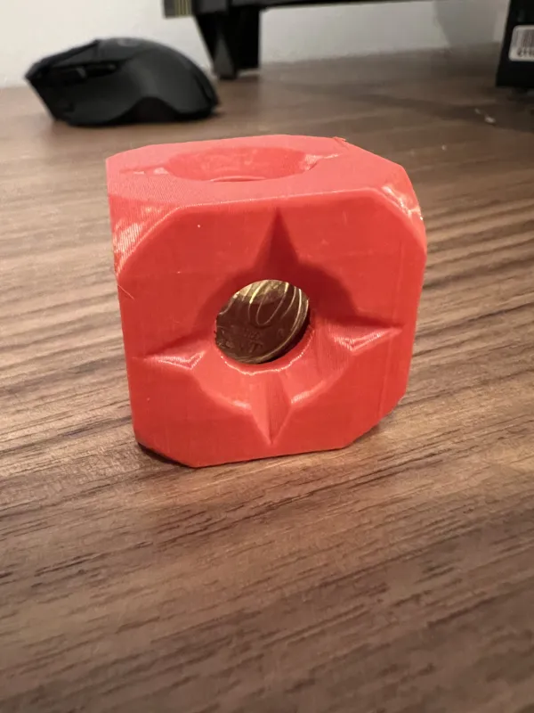 A coin stuck in a cube