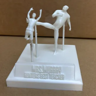 Child Getting Drop Kicked Statue