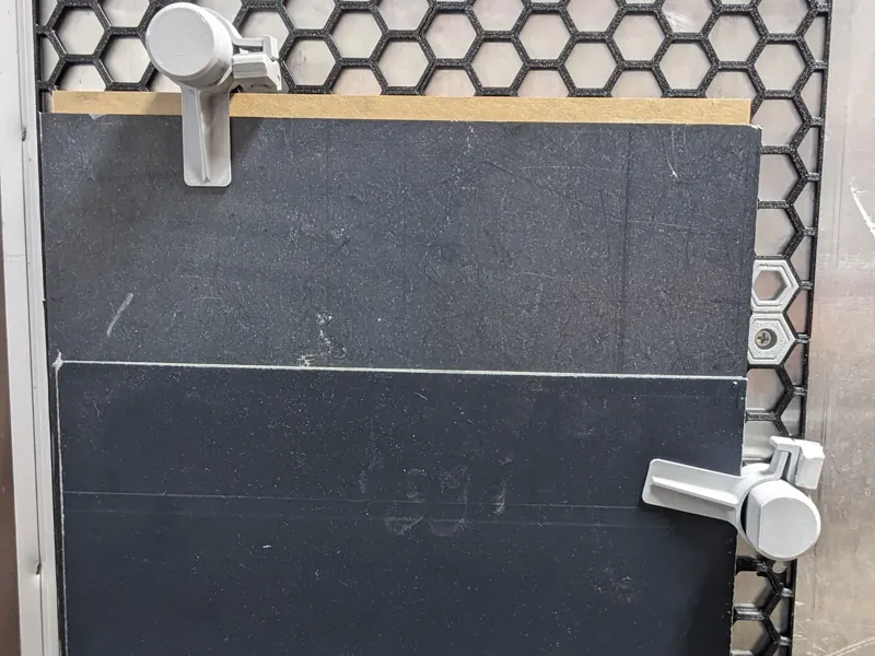 Sliding Clamp/Hold Down for Honeycomb Storage Wall