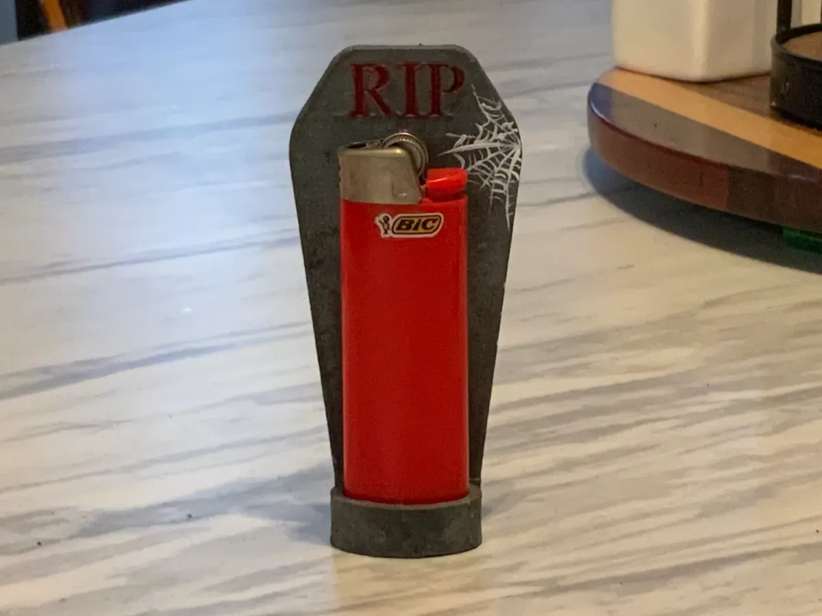 Support briquet pierre tombale RIP