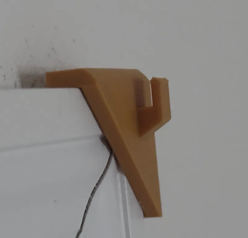 Door trim light string hangers
