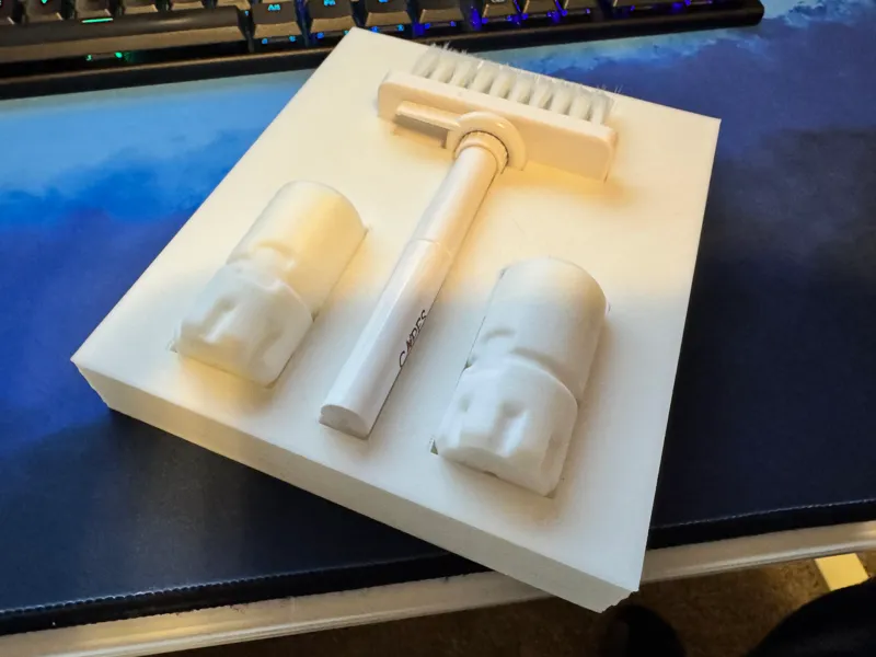 Desk drawer keyboard brush holder