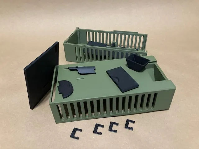 A green and black plastic container
Description automatically generated