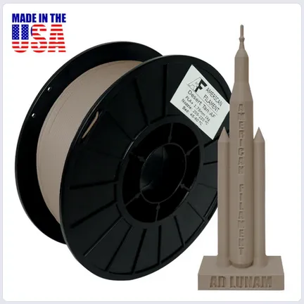 A spool of wire with a statue of a tall tower
Description automatically generated