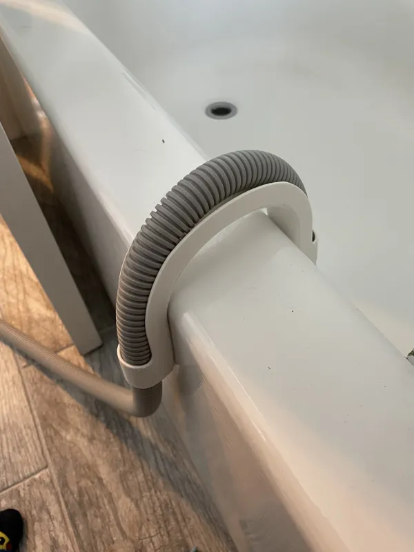 Bathtub portable washing machine drain hose holder