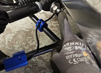 Holder for brakelines on control arms. 