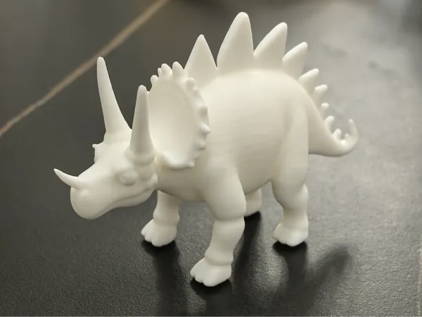 Figurine stégosaure à tête mobile