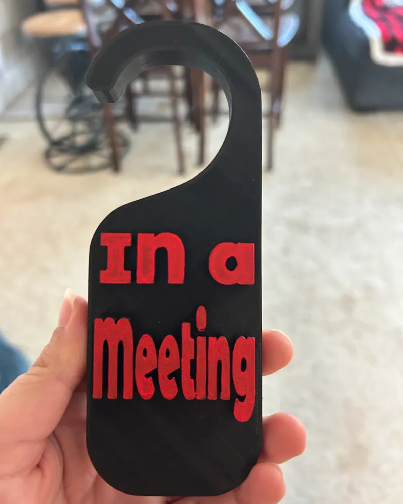 In A Meeting Doorknob Sign