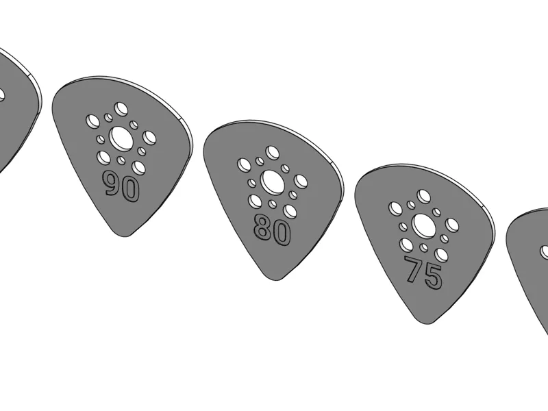 Set of guitar picks with holes for added grip