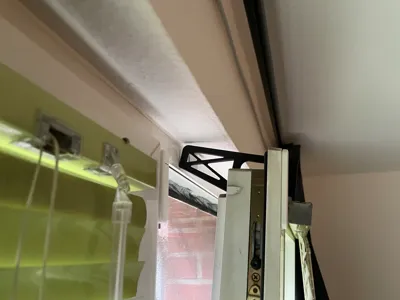 Hold open a tilted window on windy days