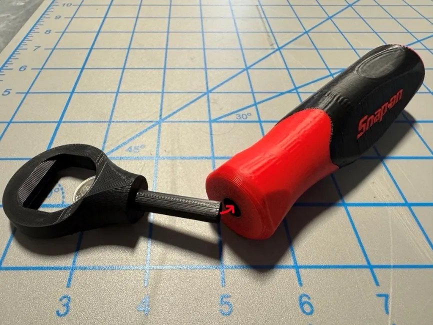 A bottle opener on a grid

Description automatically generated