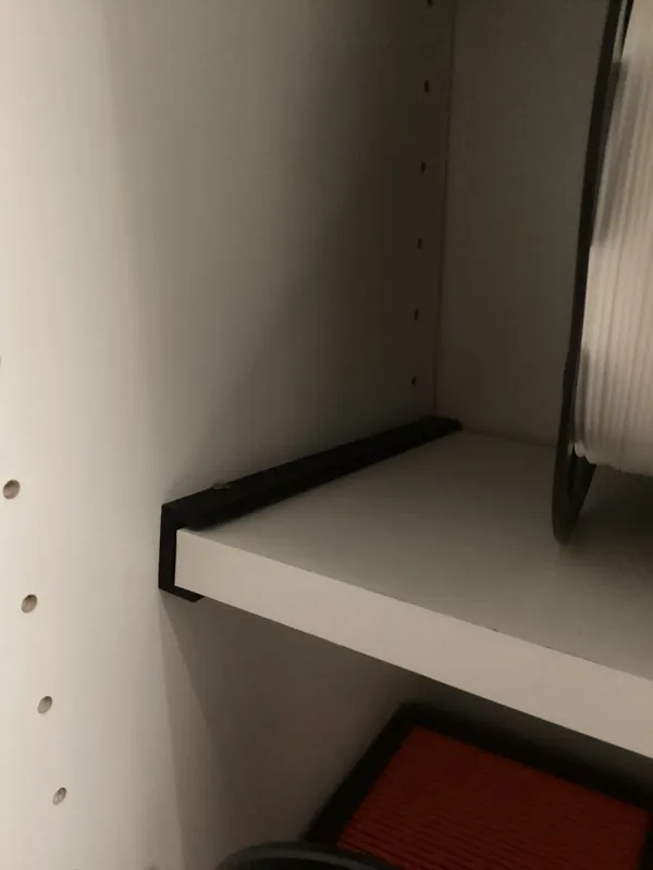 Holder for attaching a laminate board
