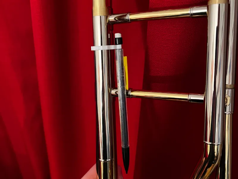 Trombone pencil holder