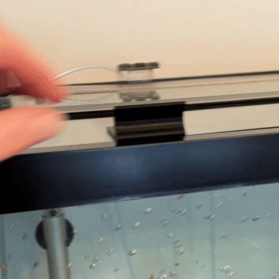 Fish tank lid handle lifter