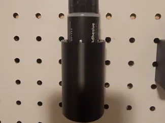 Peg board adhesive glue holder