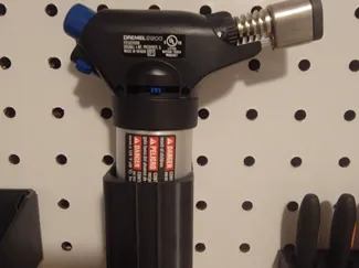 Torch peg board holder 