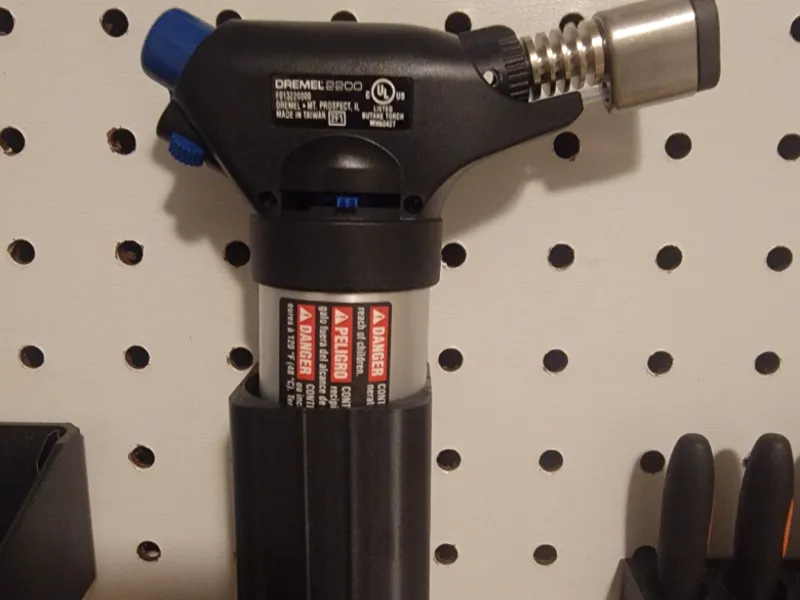 Torch peg board holder 