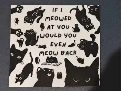 A gaggle of little black cats