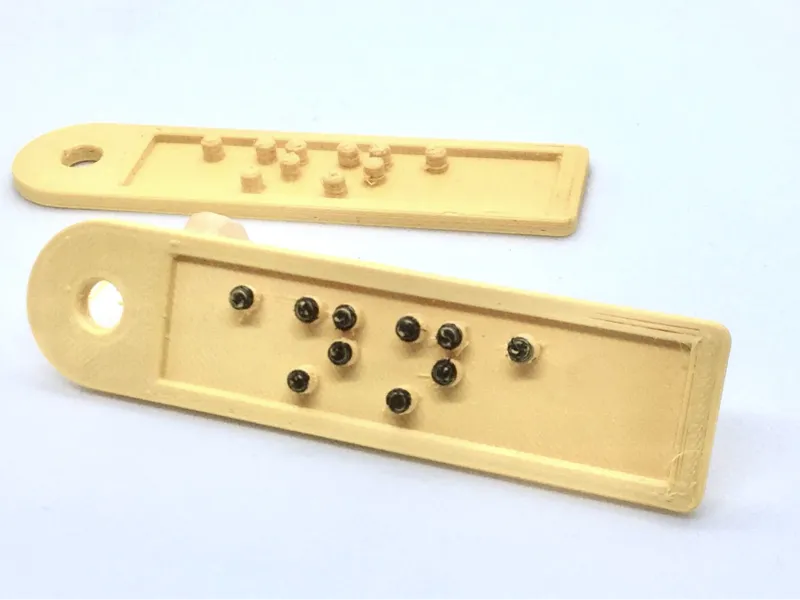 Keychain with the name Anna written in Braille