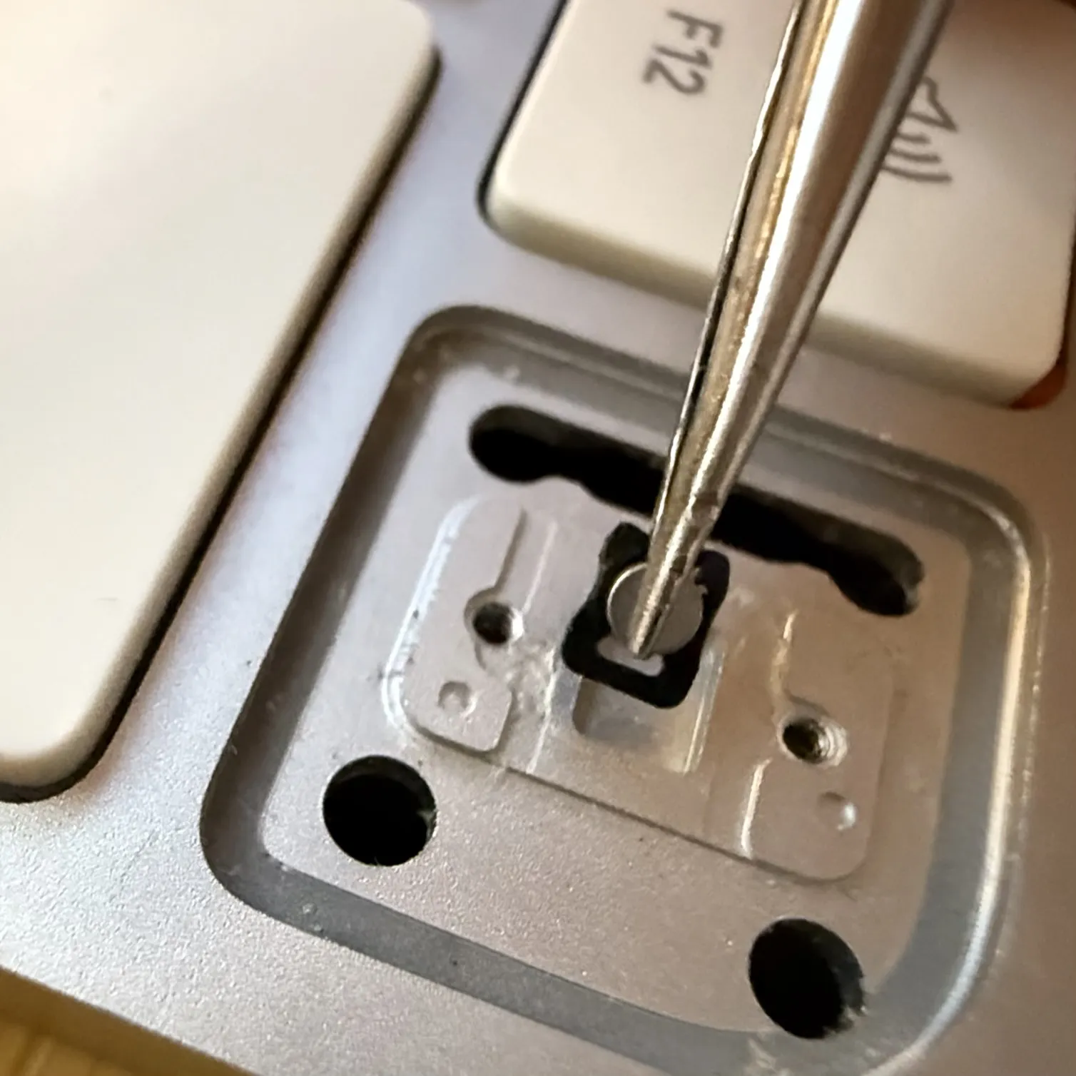 Close-up shot of parts of the original button assembly