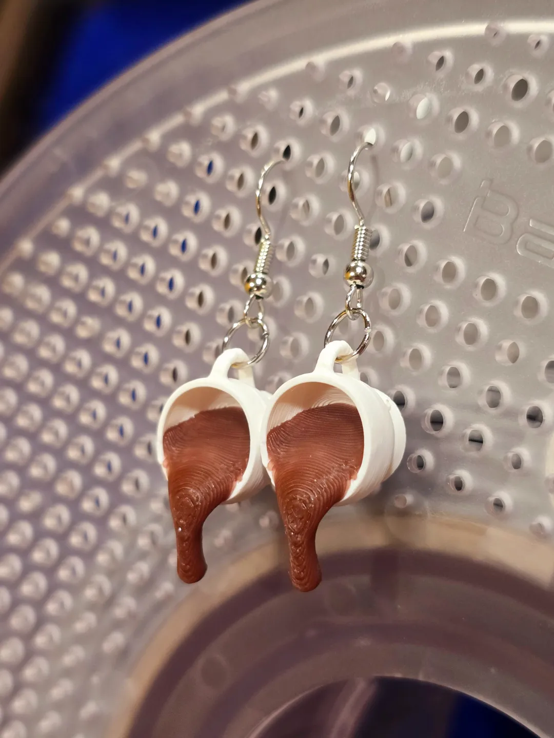 3D Coffee spilling earrings view 2
