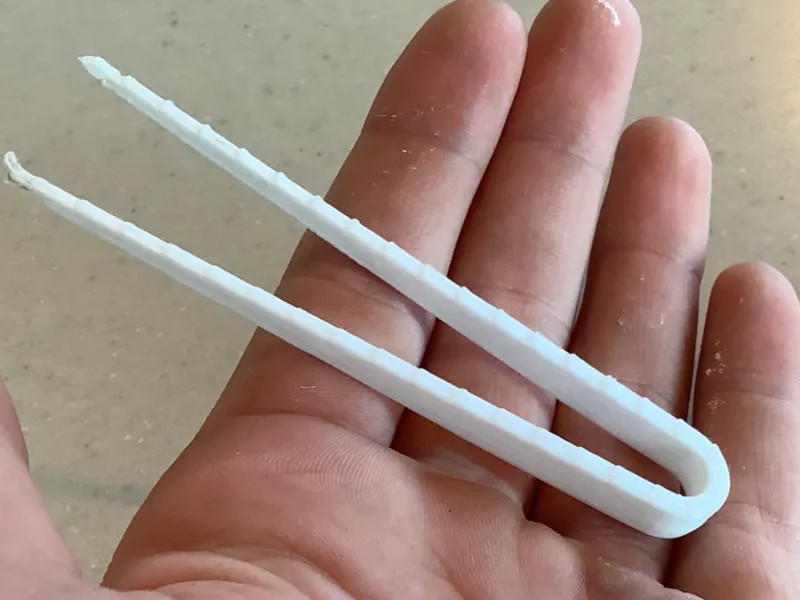 Small tongs for reptile feeding.