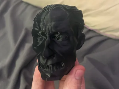 ugly man statue