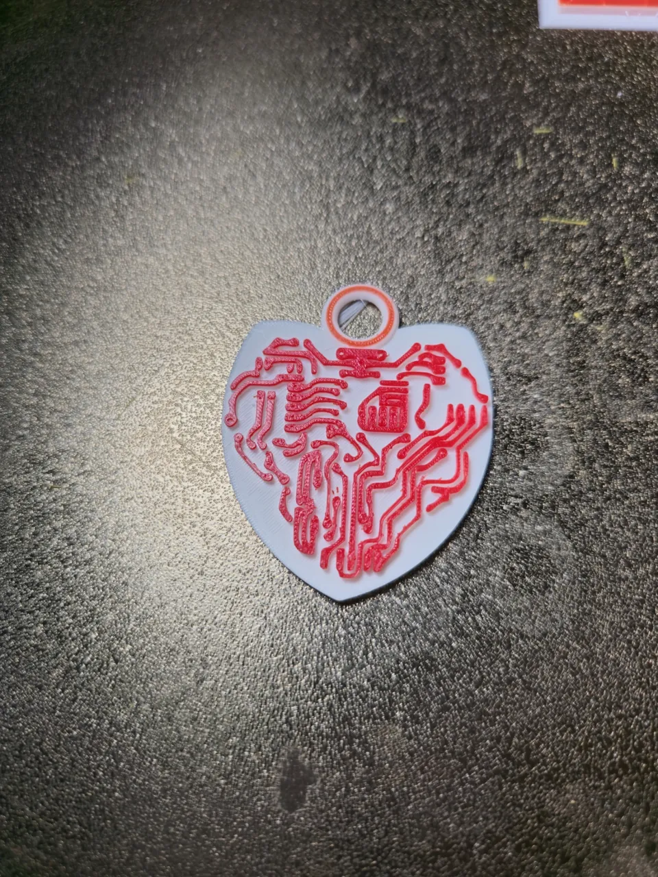 Circuit heart earring view 2