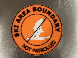 Ski area boundary - not patrolled - sign