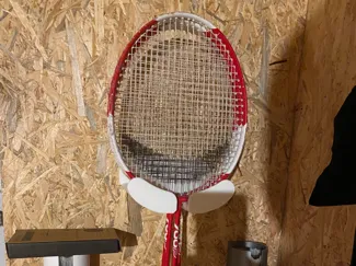 support raquette badminton