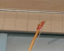 Pole-mounted rope hanger