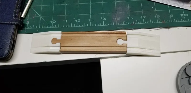 Wood train track ramp with hole