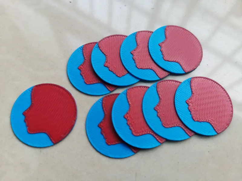 Multicolor coin with a face