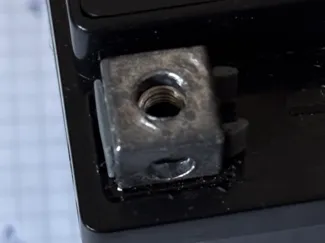 Battery nut holder