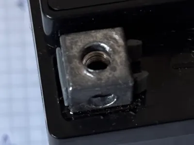 Battery nut holder