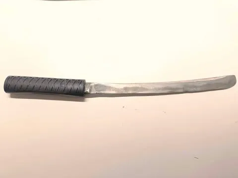 Handle for a knife, stylized as Japanese Tanto.