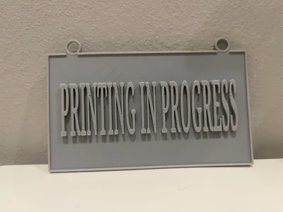 Printing in progress sign