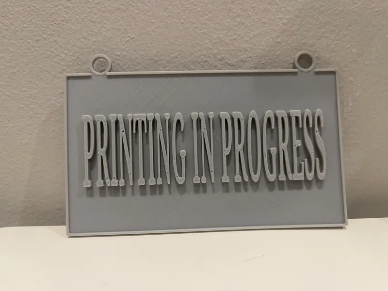 Printing in progress sign