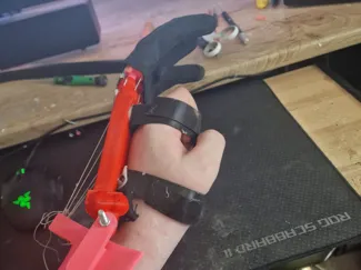 Wrist powered simple prosthetic arm