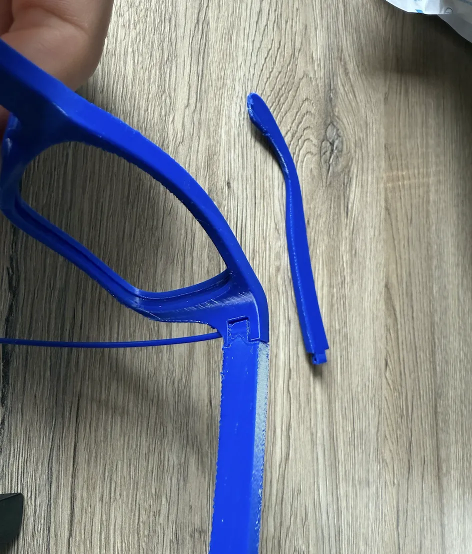 Use a piece of 1.75mm filament as a hinge pin