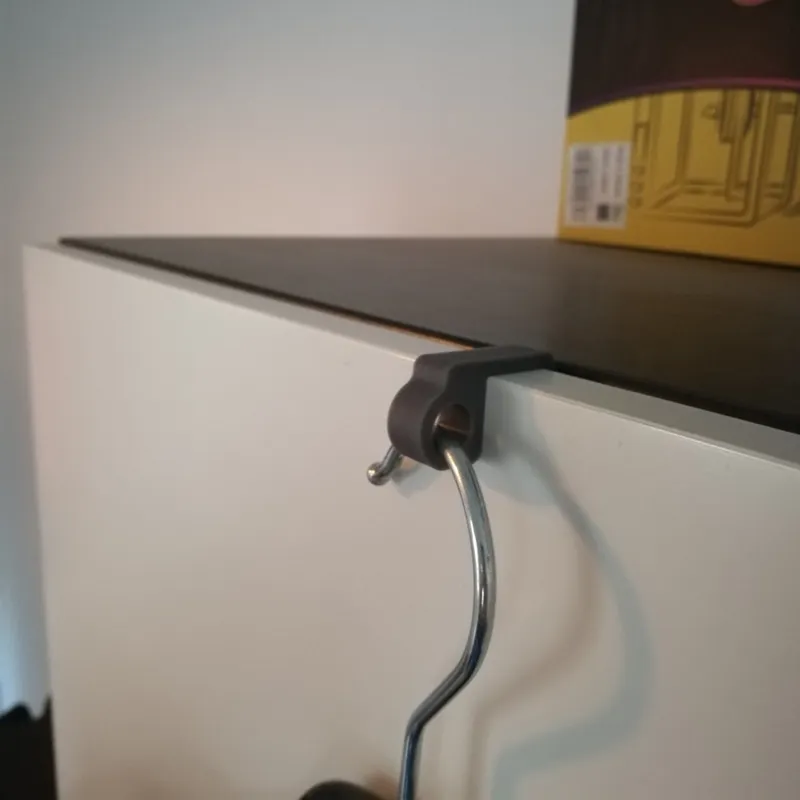 Coat hanger hook for cabinet door