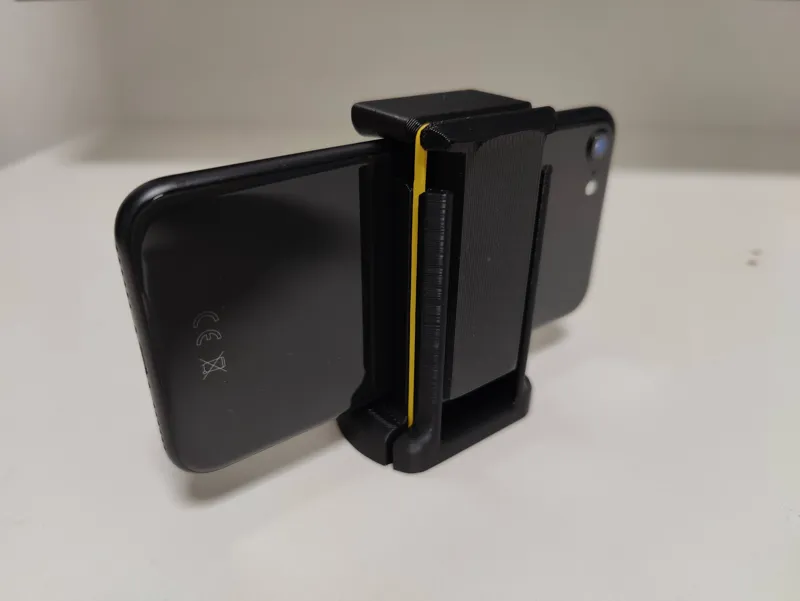 Phone holder for a tripod