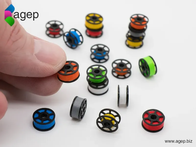 3D printed miniature filament spools.
