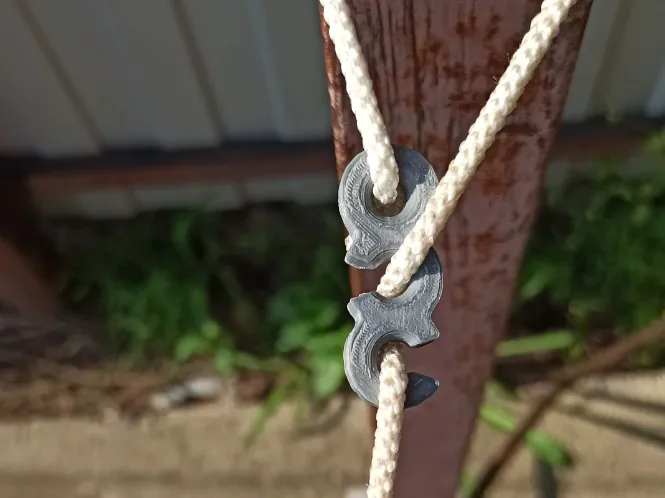 Paracord cord fastener and tensioner.