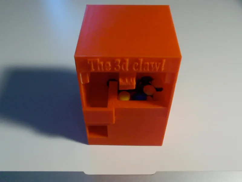 Candy claw machine, but the claw is an extruder!