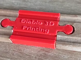 Toy train rail connector